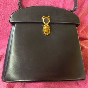 Vintage Murray Kruger black leather top handle bag with aqua leather interior